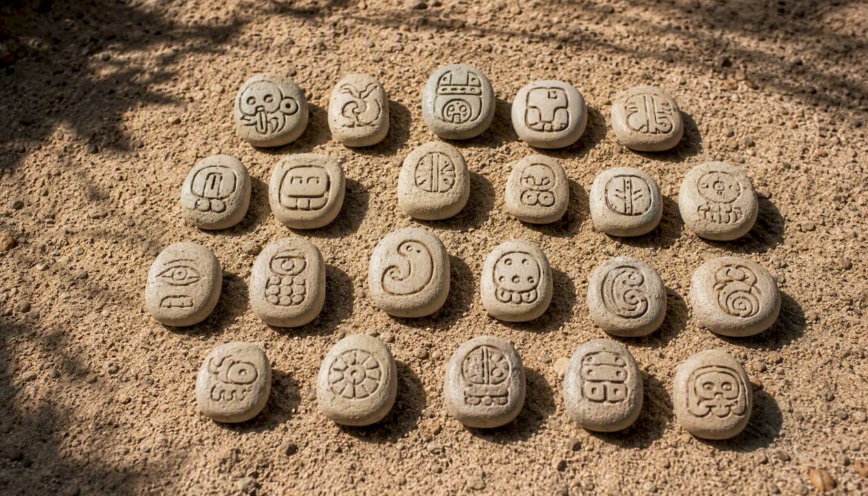 Carved stones with Mayan day sign glyphs