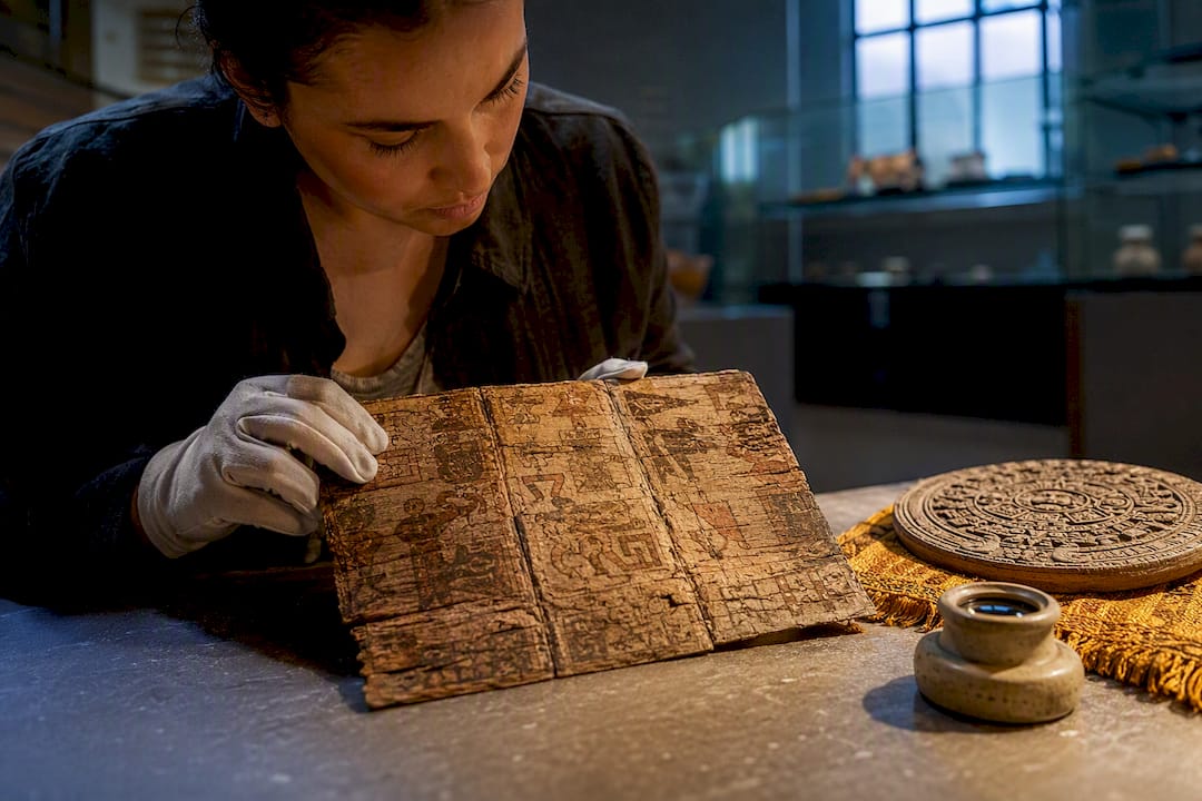 Codex fragment beside Maya calendar reproduction